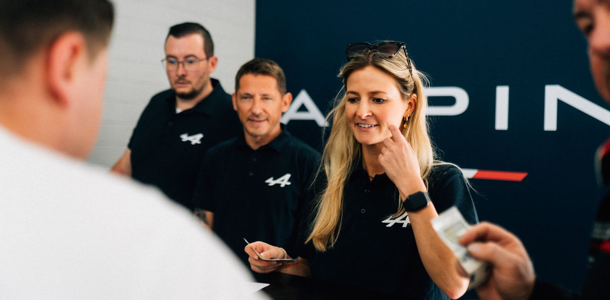 Beautiful woman at the enrolment for the Alpine A110 Track Experience